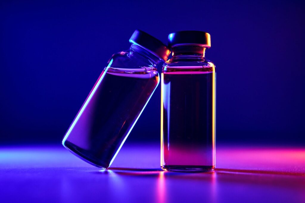 Medical vials representing peptide-based treatment